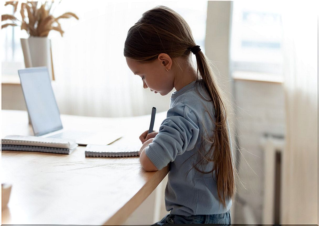 Girl doing homework with good postural hygiene.