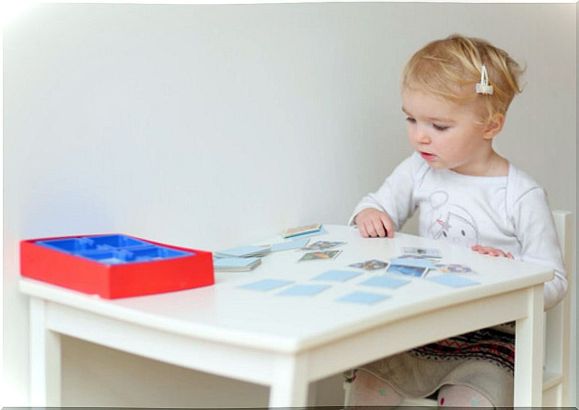 Girl playing games to encourage reasoning and logic.