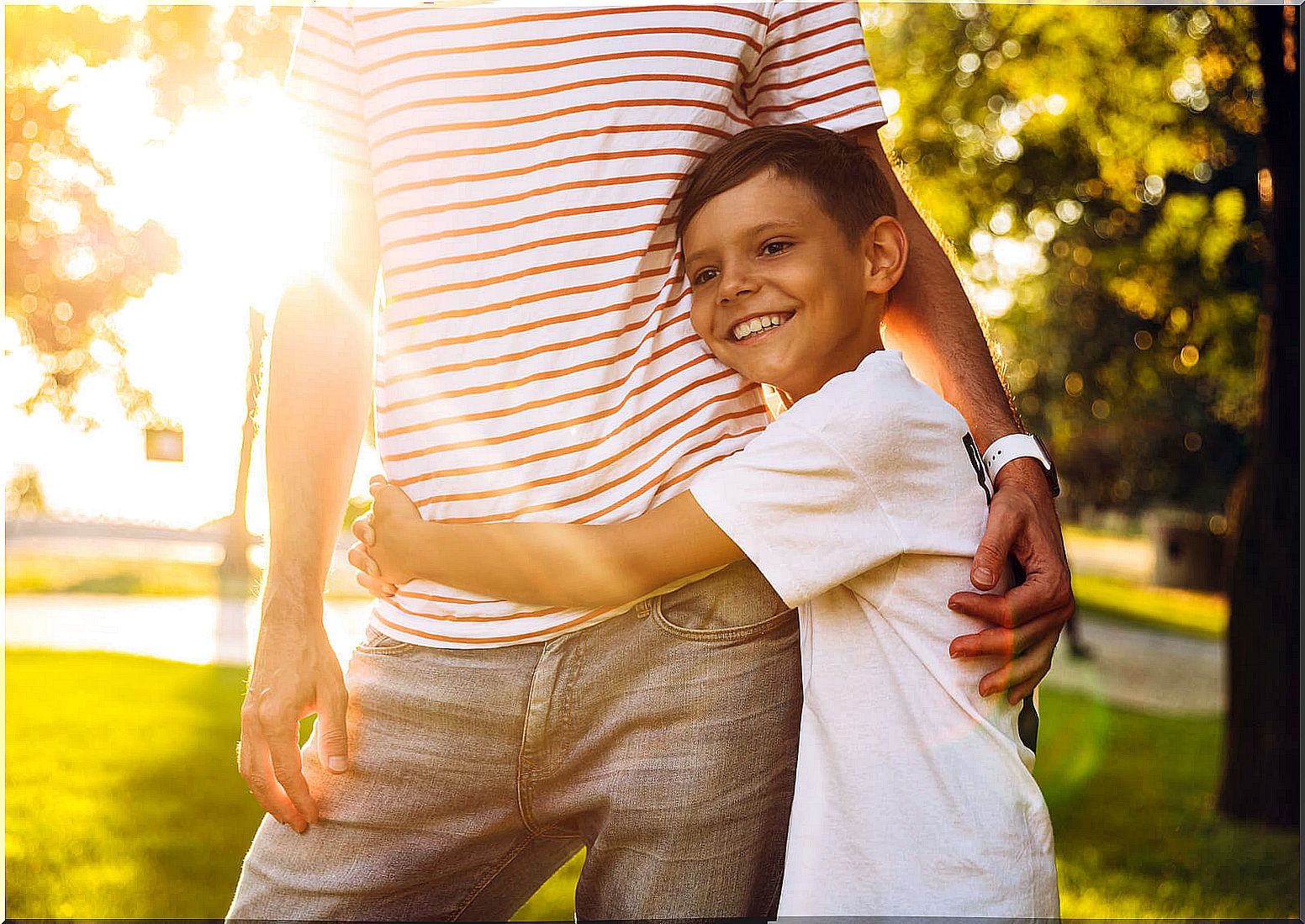 Boy hugging his father because he knows he can do things for himself.