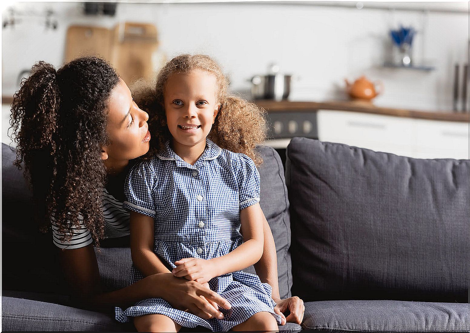 Mother talking with her daughter to develop emotional maturity.