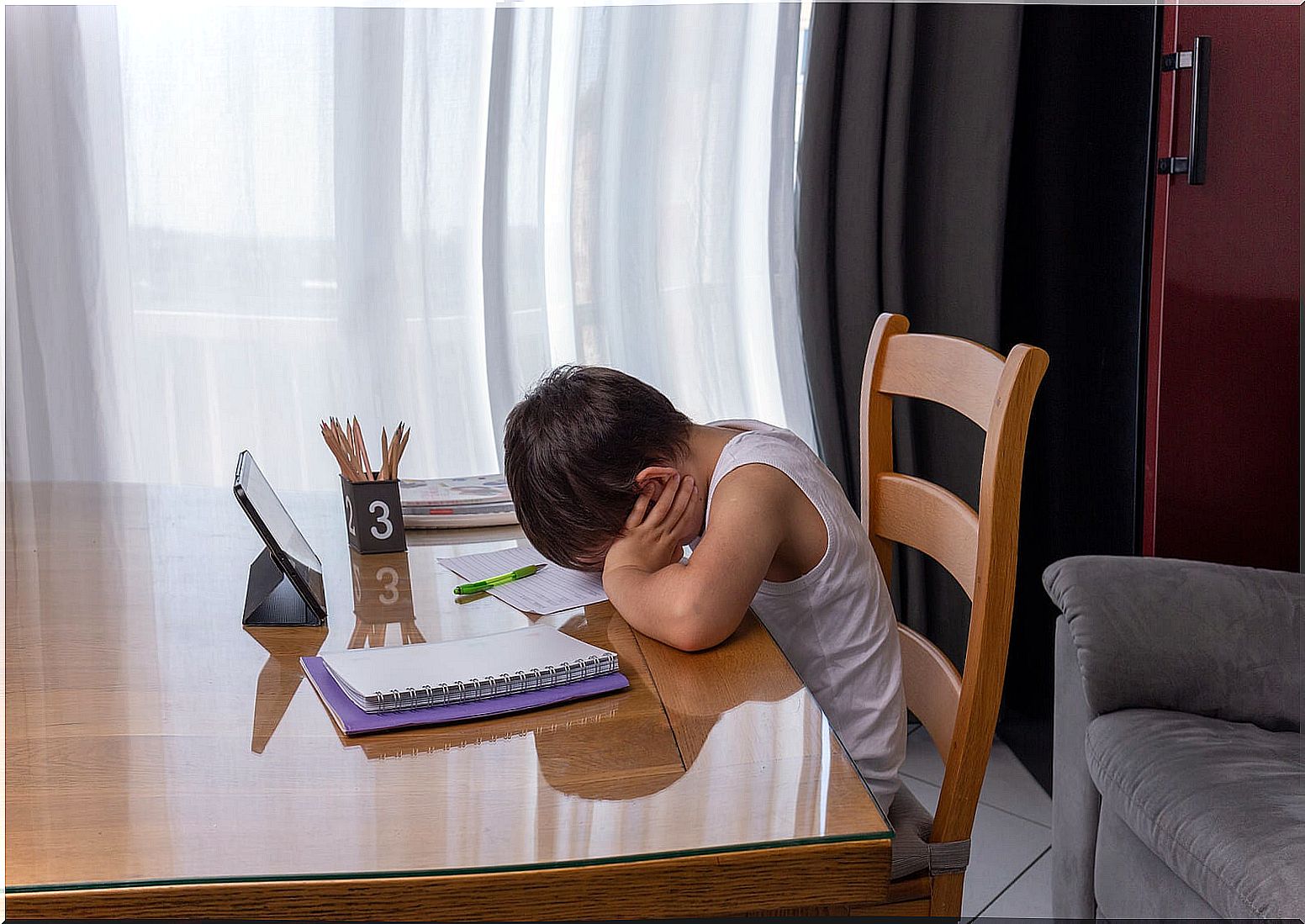 Child getting tired at the time of doing homework.