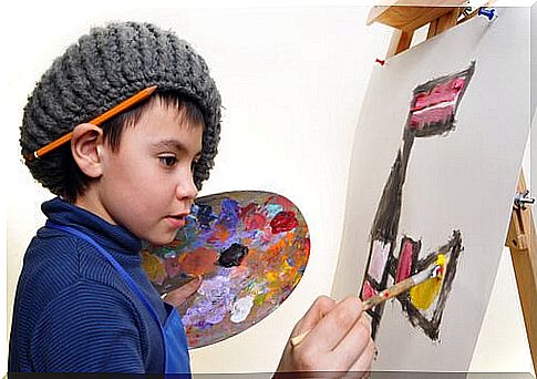 Child making a painting to express his creative talent.