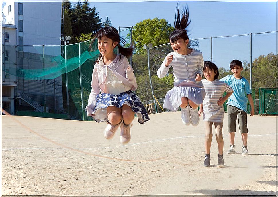 Children skipping rope during recess.