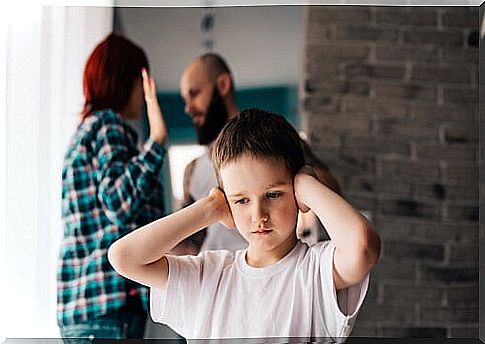 Boy covering his ears while his parents argue about the divorce.