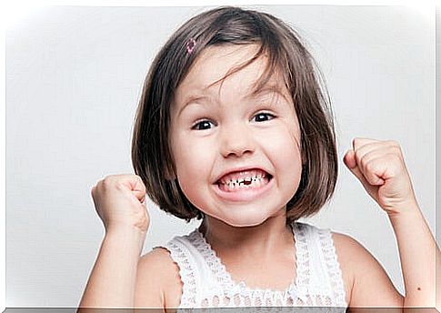 Happy girl smiling and showing teeth