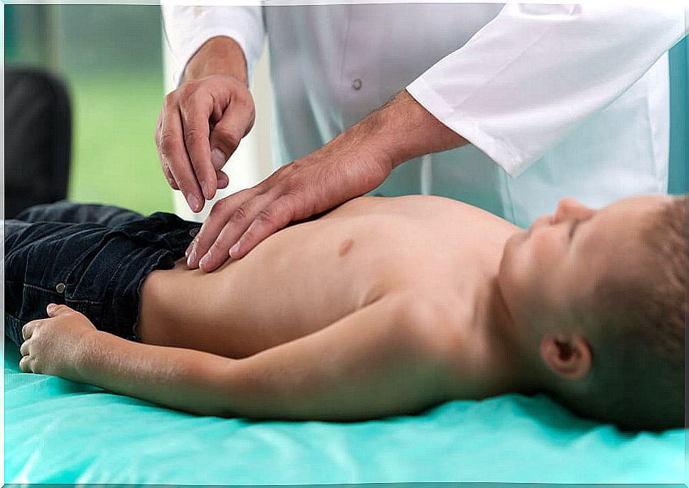 Boy being recognized by a doctor for his Crohn's disease.