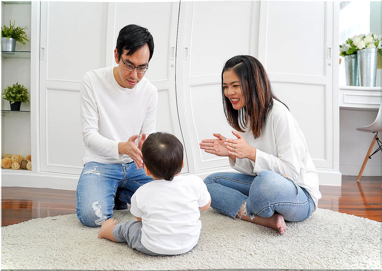 Father playing with his son to stimulate language at home.